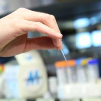 Close up of hand with pipette